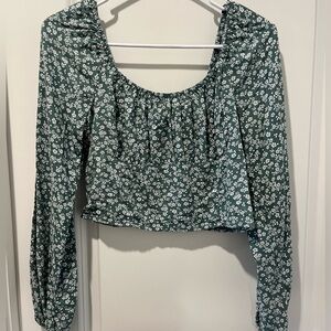 Green and white floral blouse